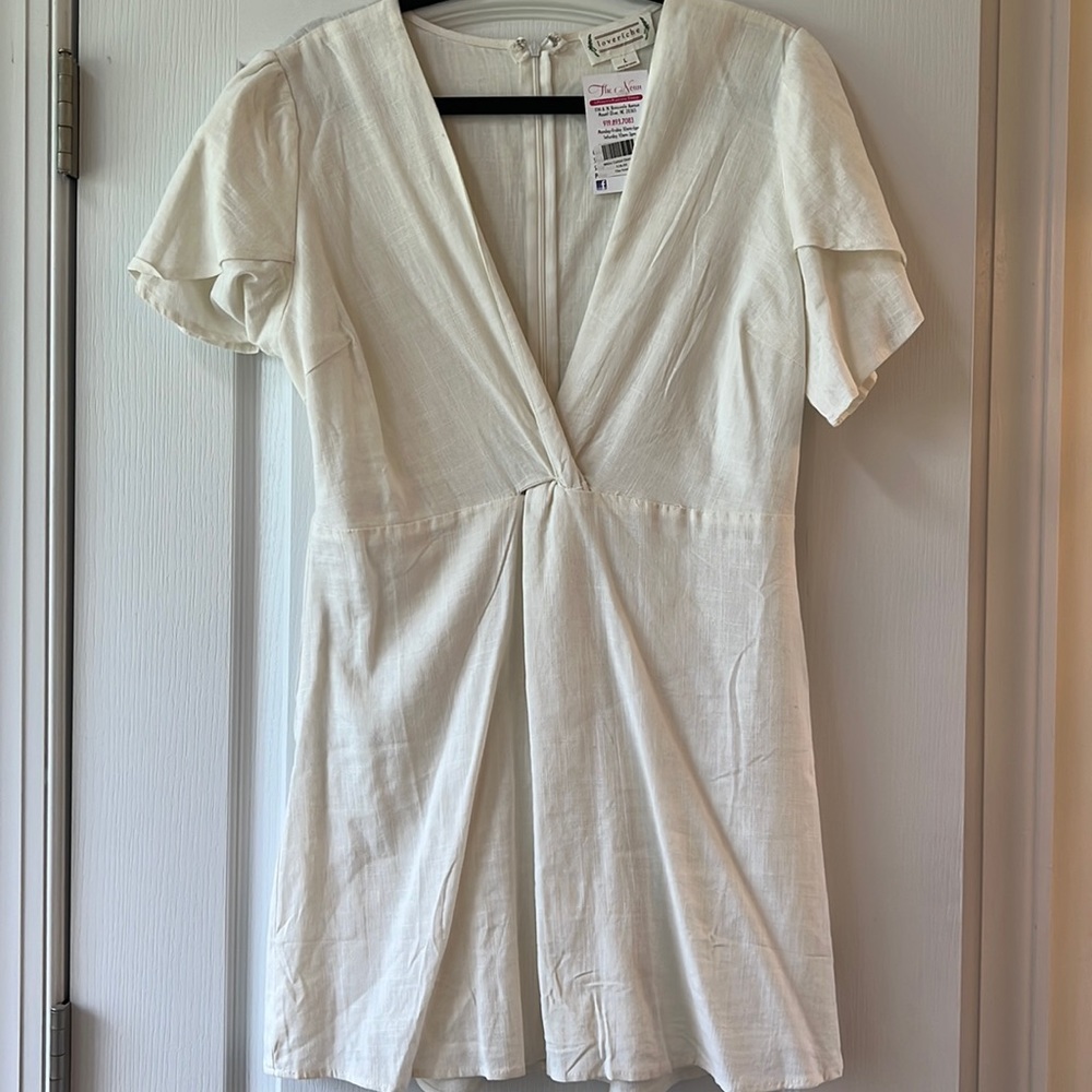 White cotton dress low v neck and ruffle sleeve NWT
